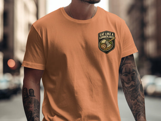 Lumberjack Thanksgiving T-shirt with axe and plate badge; “Eat Like a Lumberjack” text