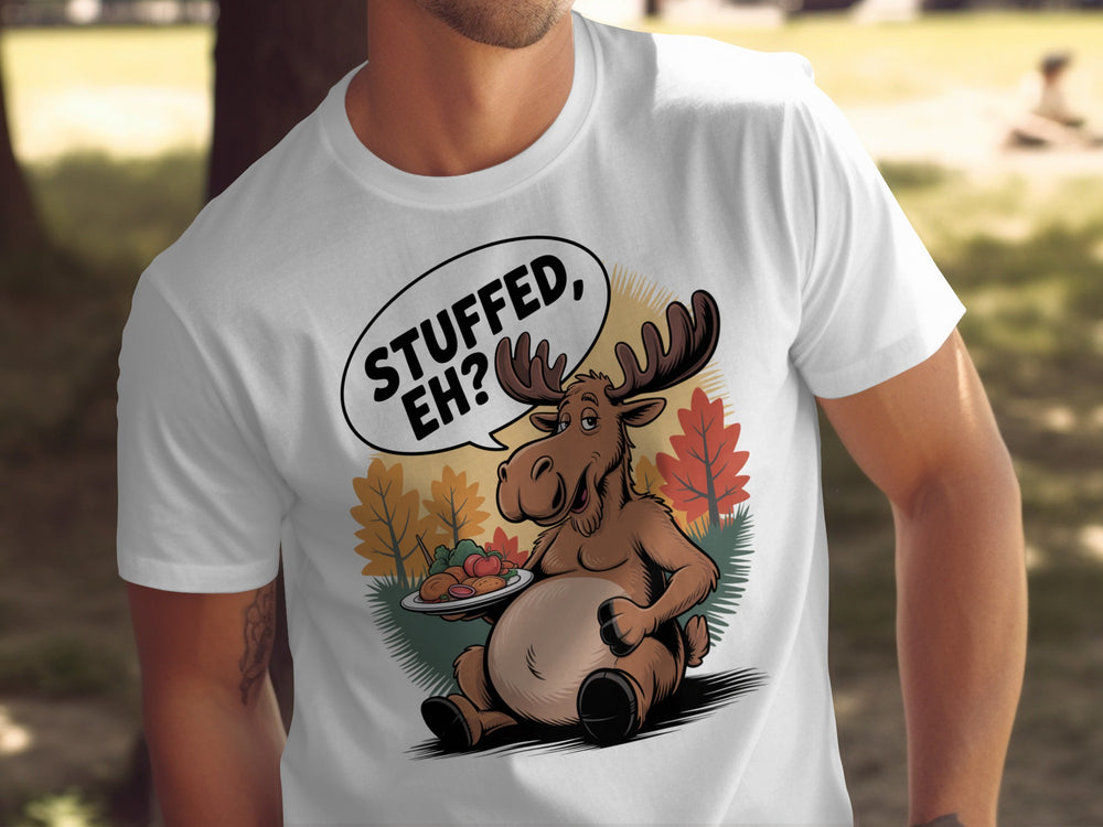 Canadian Thanksgiving men’s T-shirt with cartoon moose saying “Stuffed, Eh?” amid fall trees