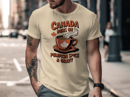 Thanksgiving men’s T-shirt with coffee cup maple leaf graphic and “Canada runs on pumpkin spice & gravy” text