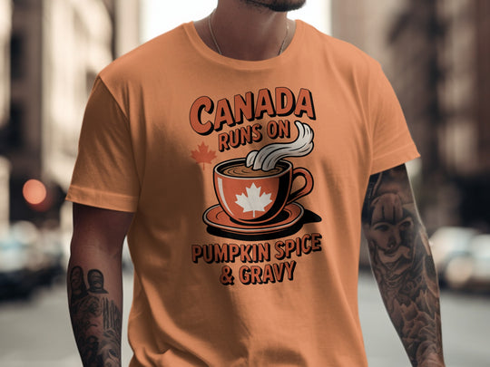 Thanksgiving men’s T-shirt with coffee cup maple leaf graphic and “Canada runs on pumpkin spice & gravy” text