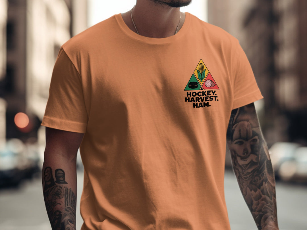 Hockey Thanksgiving men’s T-shirt with “Hockey. Harvest. Ham.” triangle corn, puck, and ham design