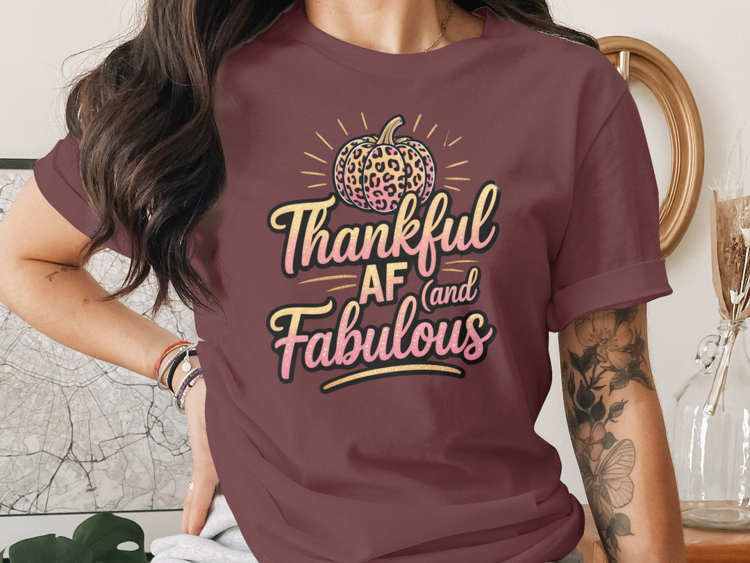 women's thanksgiving t-shirt with “thankful af and fabulous” leopard pumpkin and glitter script