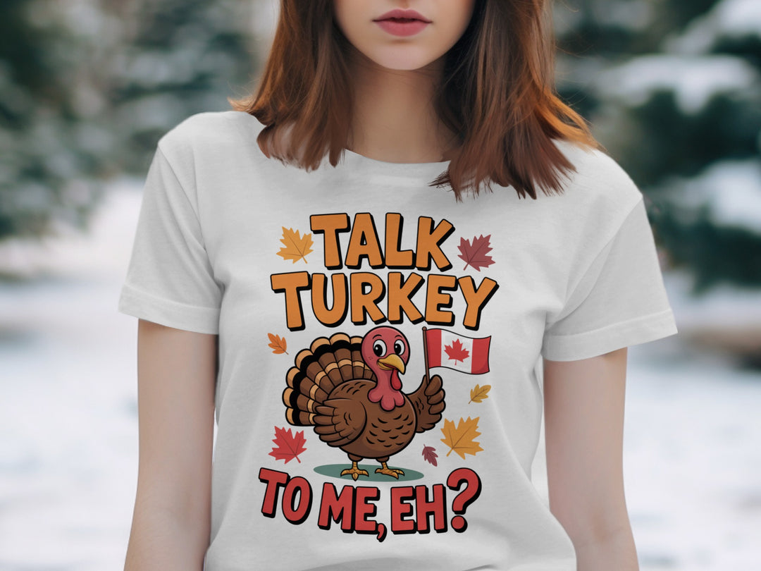 women's thanksgiving t-shirt with “talk turkey to me, eh?” turkey holding canadian flag and maple leaves