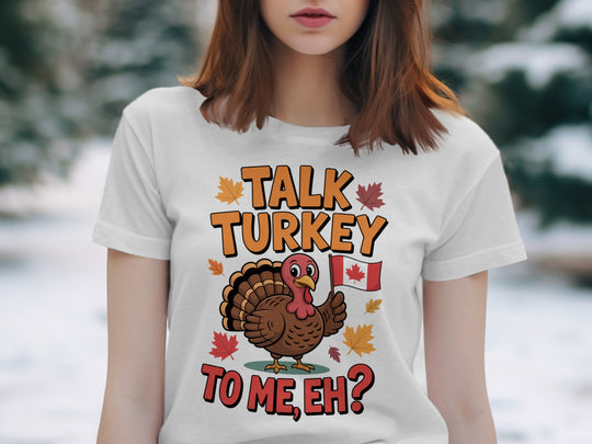women's thanksgiving t-shirt with “talk turkey to me, eh?” turkey holding canadian flag and maple leaves
