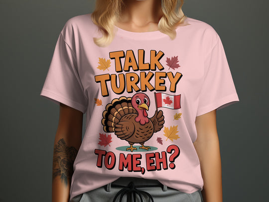women's thanksgiving t-shirt with “talk turkey to me, eh?” turkey holding canadian flag and maple leaves