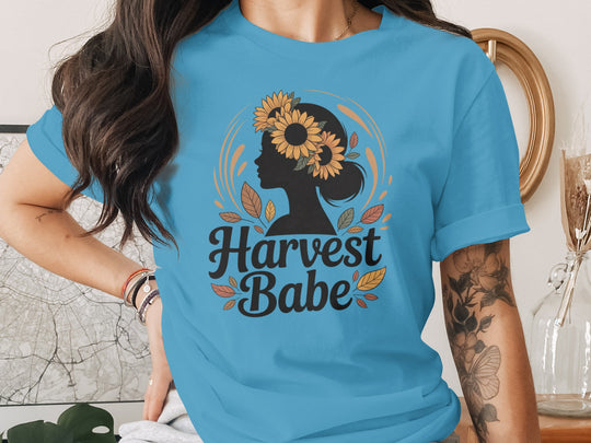 women's thanksgiving t-shirt with “harvest babe” silhouette and sunflower crown graphic
