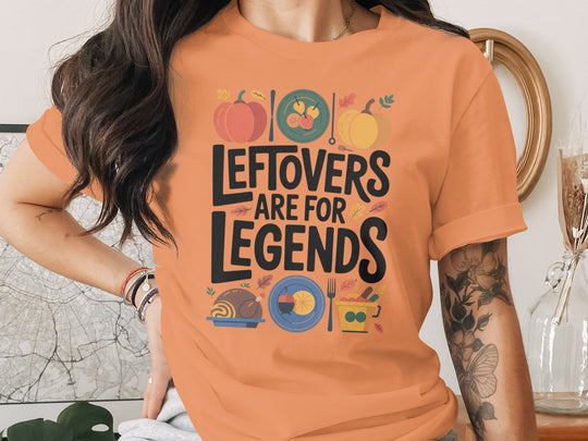 women's thanksgiving t-shirt with 'leftovers are for legends' pumpkins and feast icons graphic