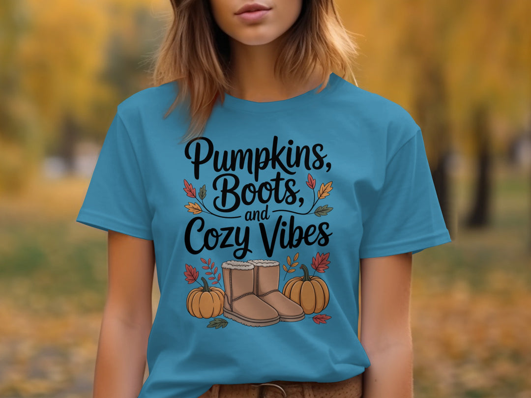 women's thanksgiving t-shirt with “pumpkins, boots, and cozy vibes” pumpkins and boots graphic