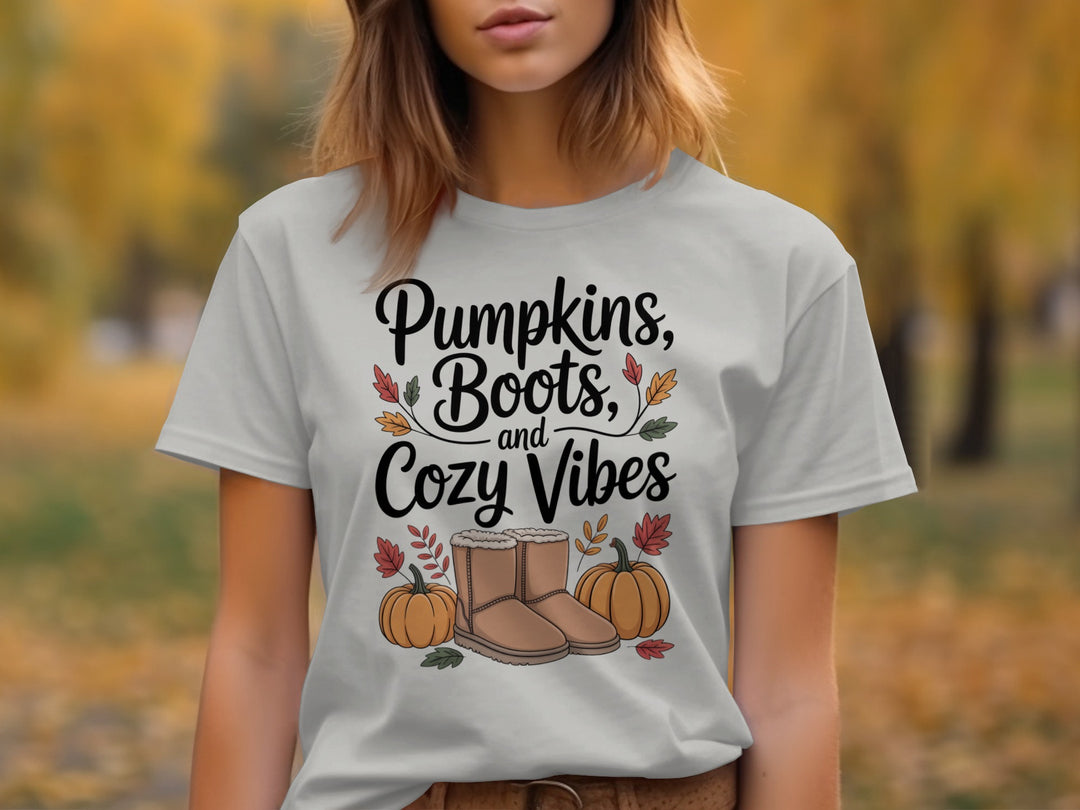 women's thanksgiving t-shirt with “pumpkins, boots, and cozy vibes” pumpkins and boots graphic