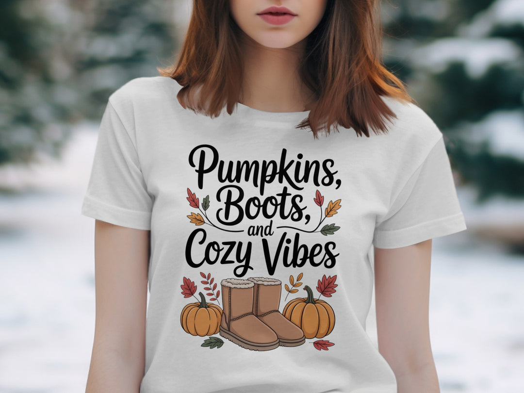 women's thanksgiving t-shirt with “pumpkins, boots, and cozy vibes” pumpkins and boots graphic