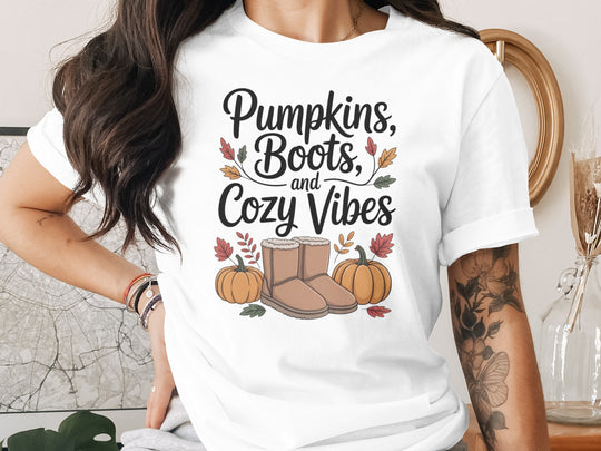 women's thanksgiving t-shirt with “pumpkins, boots, and cozy vibes” pumpkins and boots graphic