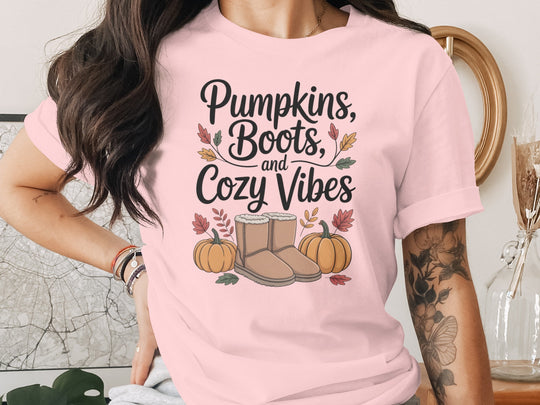 women's thanksgiving t-shirt with “pumpkins, boots, and cozy vibes” pumpkins and boots graphic