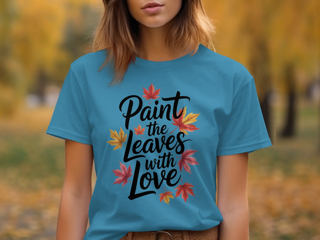 women’s thanksgiving t-shirt with “paint the leaves with love” maple leaves graphic