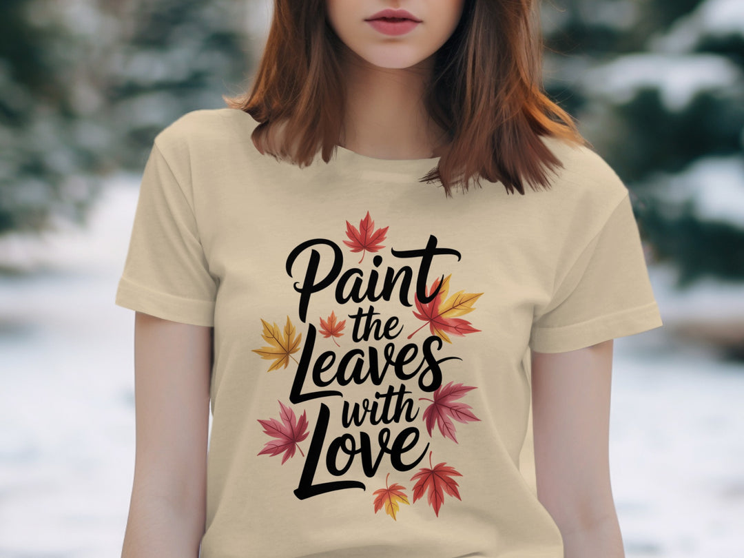women’s thanksgiving t-shirt with “paint the leaves with love” maple leaves graphic