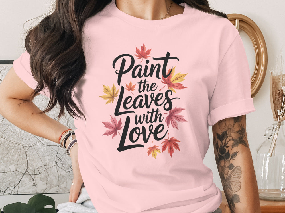 women’s thanksgiving t-shirt with “paint the leaves with love” maple leaves graphic