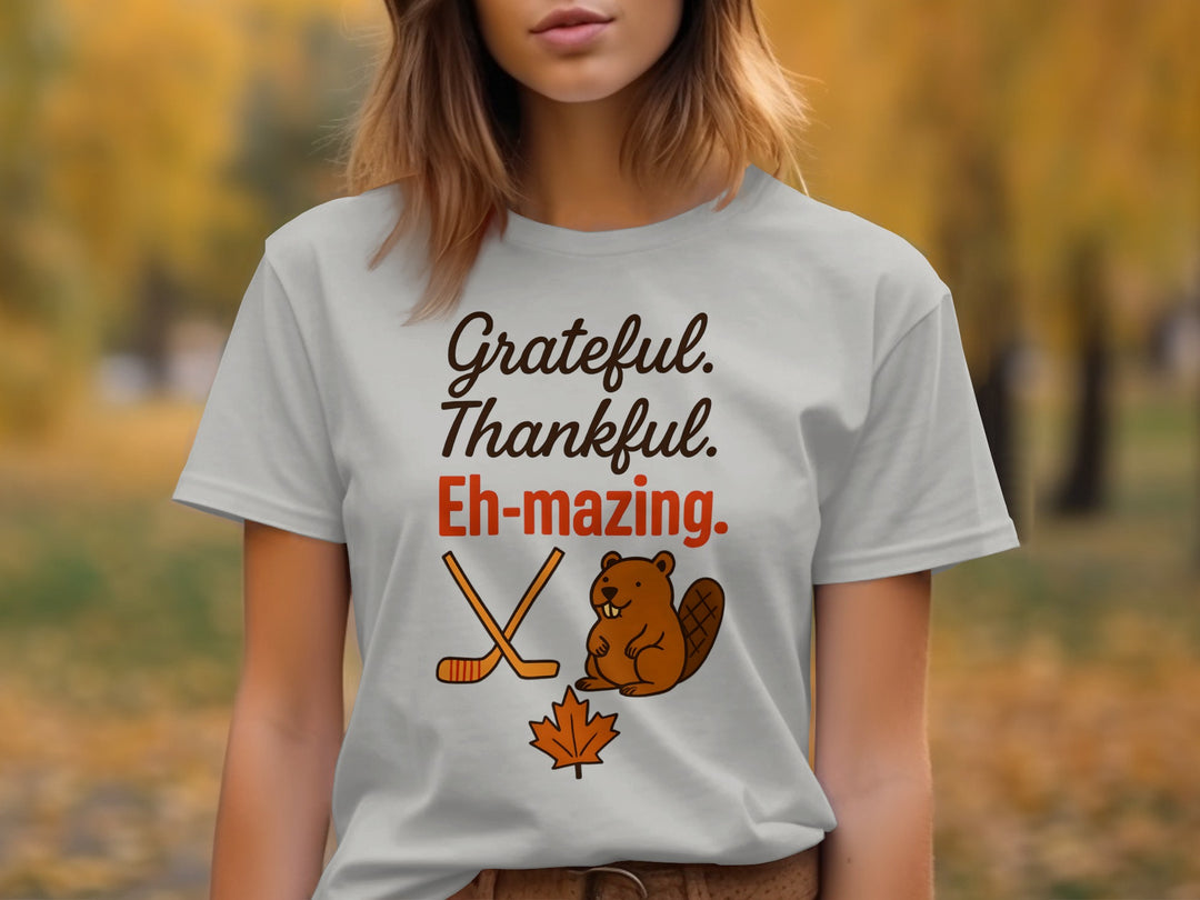 women's thanksgiving t-shirt with 'grateful thankful eh-mazing' beaver, hockey sticks and maple leaf graphic