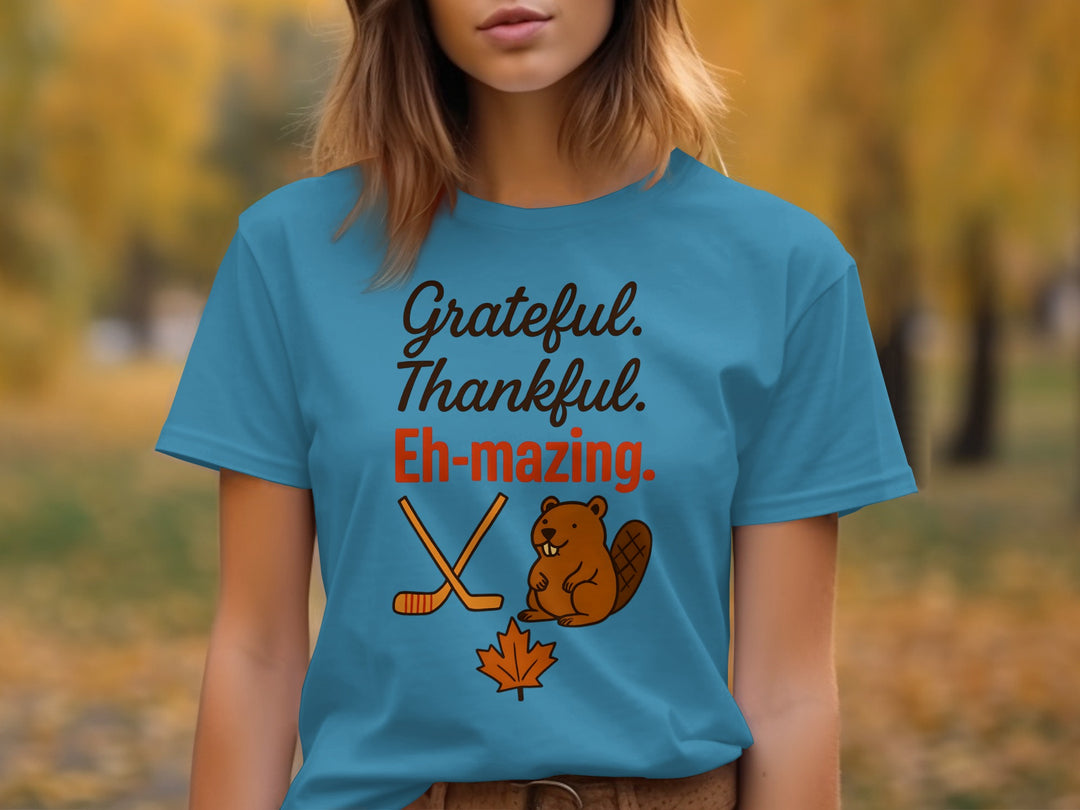 women's thanksgiving t-shirt with 'grateful thankful eh-mazing' beaver, hockey sticks and maple leaf graphic