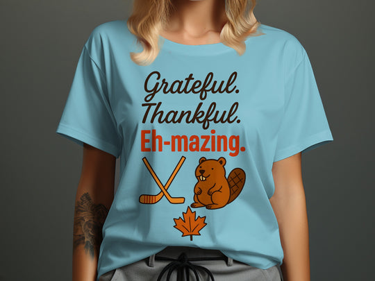 women's thanksgiving t-shirt with 'grateful thankful eh-mazing' beaver, hockey sticks and maple leaf graphic