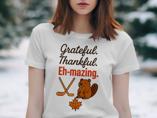 women's thanksgiving t-shirt with 'grateful thankful eh-mazing' beaver, hockey sticks and maple leaf graphic