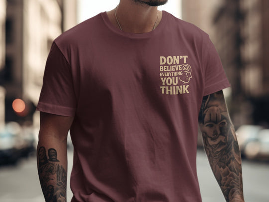 funny men's t-shirt with “don't believe everything you think” quote and spiral head graphic