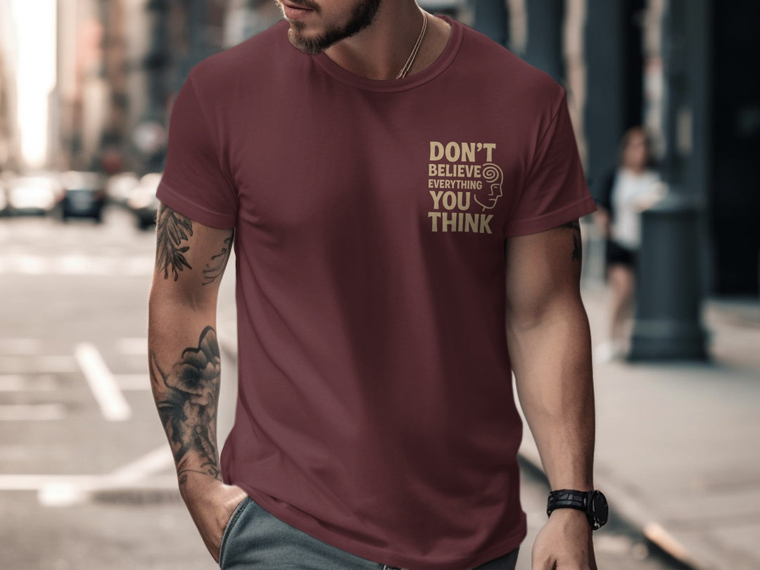 funny men's t-shirt with “don't believe everything you think” quote and spiral head graphic