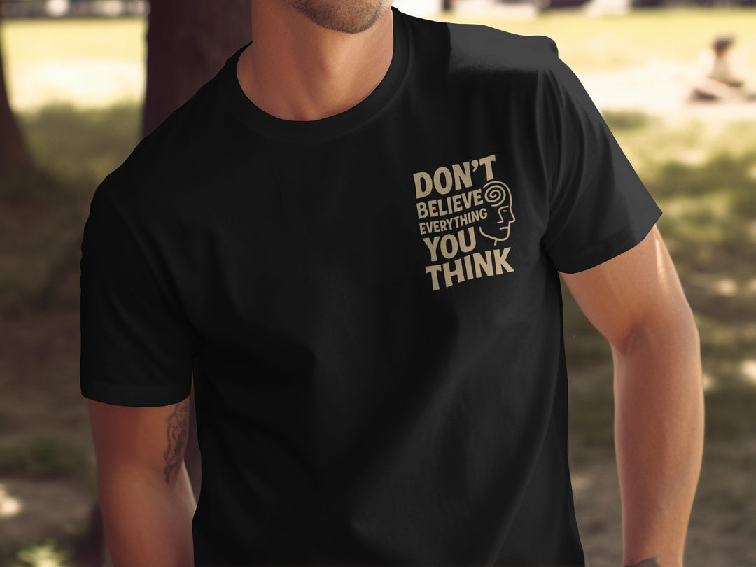 funny men's t-shirt with “don't believe everything you think” quote and spiral head graphic