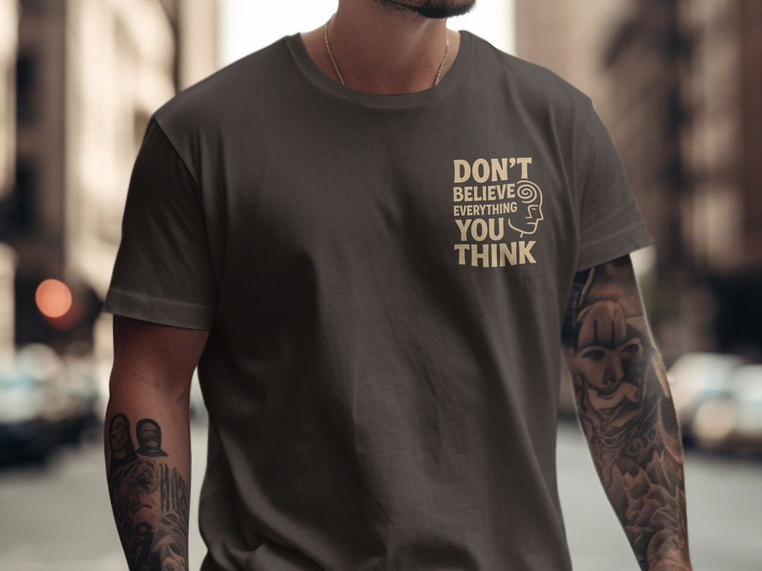 funny men's t-shirt with “don't believe everything you think” quote and spiral head graphic