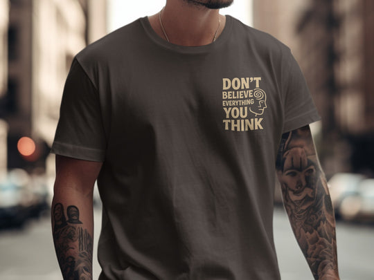 funny men's t-shirt with “don't believe everything you think” quote and spiral head graphic
