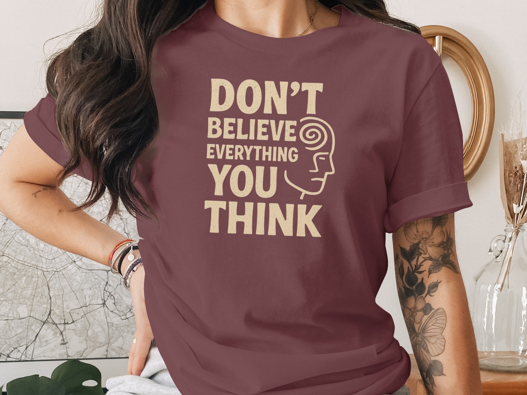 don't believe everything you think t-shirt, sand print quote, women’s graphic tee