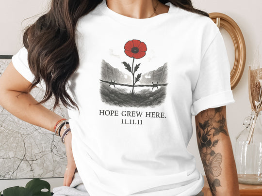 women’s remembrance day t-shirt with poppy rising from trenches — hope grew here
