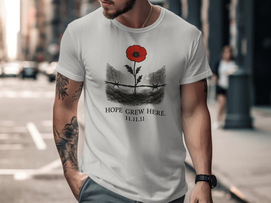 poppy growing through barbed wire trench — men’s remembrance day t-shirt