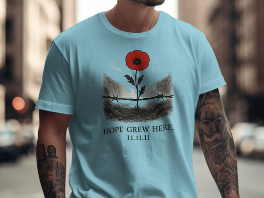 poppy growing through barbed wire trench — men’s remembrance day t-shirt
