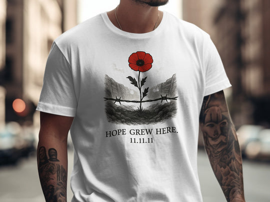 poppy growing through barbed wire trench — men’s remembrance day t-shirt