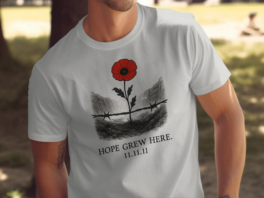 poppy growing through barbed wire trench — men’s remembrance day t-shirt