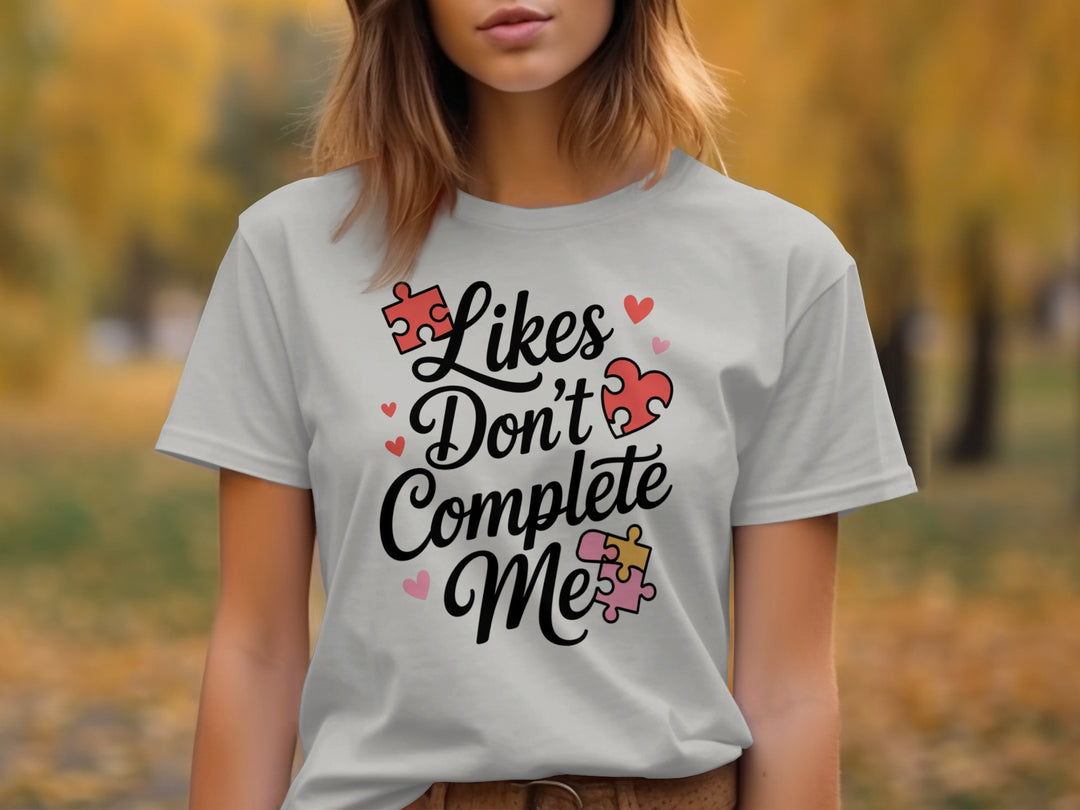 likes don’t complete me puzzle-heart graphic — women’s t-shirt