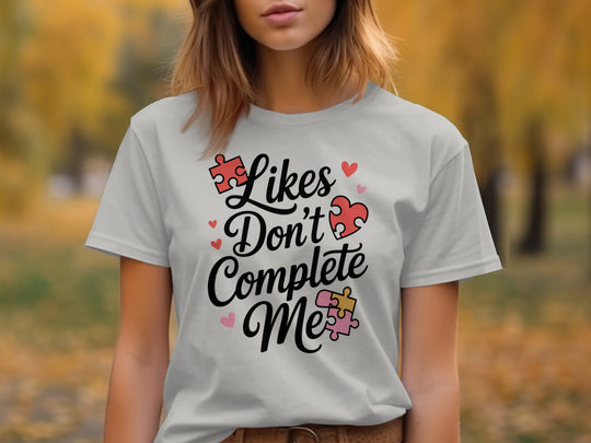 likes don’t complete me puzzle-heart graphic — women’s t-shirt