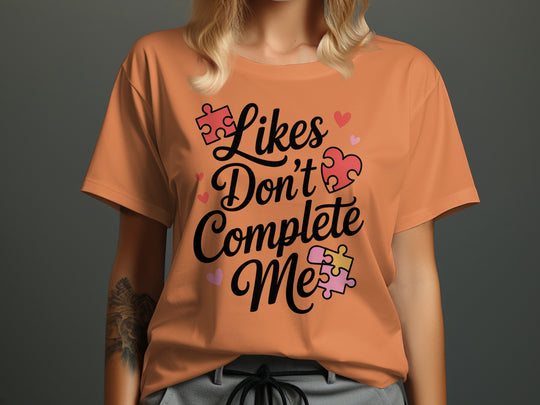 likes don’t complete me puzzle-heart graphic — women’s t-shirt