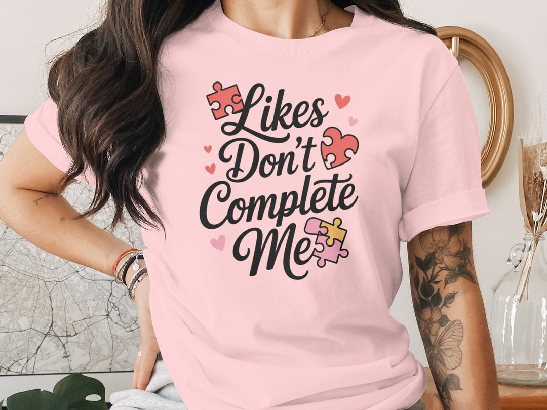 likes don’t complete me puzzle-heart graphic — women’s t-shirt