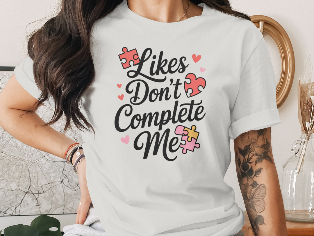 likes don’t complete me puzzle-heart graphic — women’s t-shirt