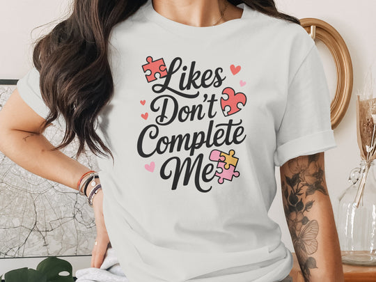 likes don’t complete me puzzle-heart graphic — women’s t-shirt