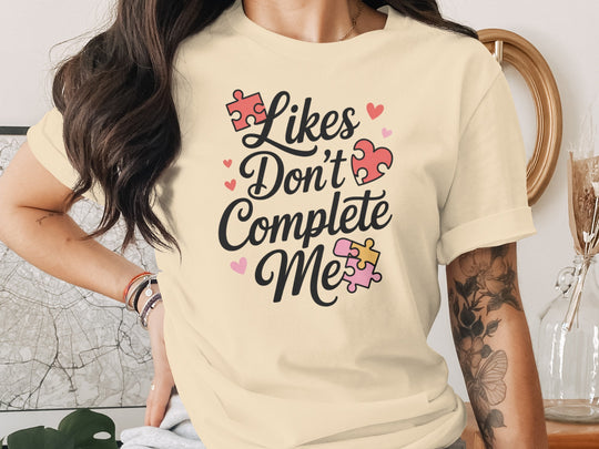 likes don’t complete me puzzle-heart graphic — women’s t-shirt