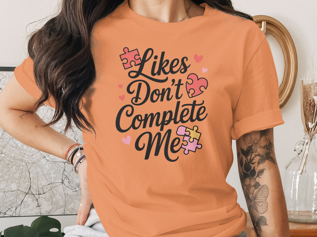 likes don’t complete me puzzle-heart graphic — women’s t-shirt