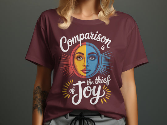 comparison is the thief of joy split sun-and-moon face — women’s t-shirt