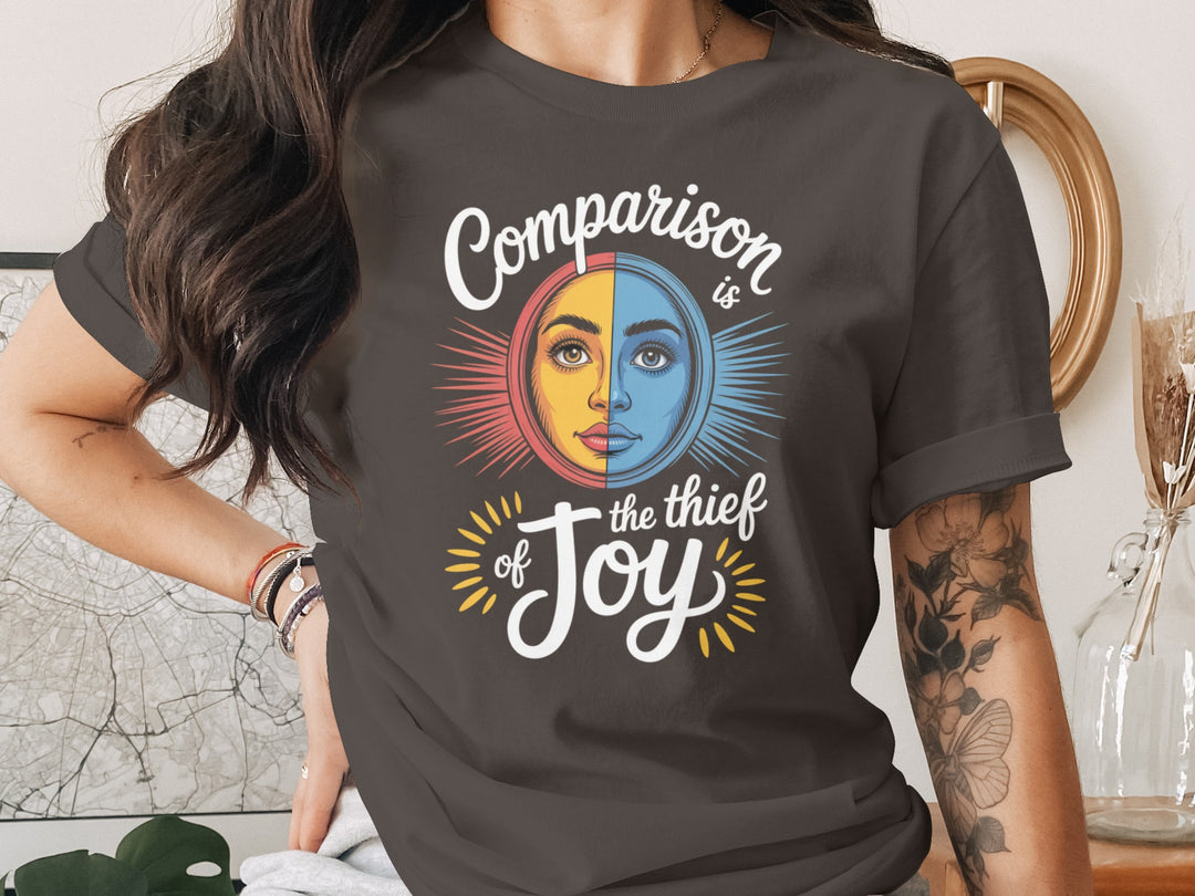 comparison is the thief of joy split sun-and-moon face — women’s t-shirt