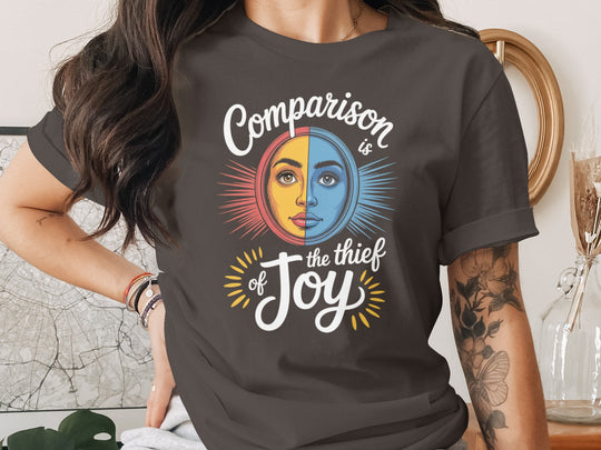 comparison is the thief of joy split sun-and-moon face — women’s t-shirt