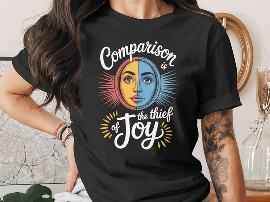 comparison is the thief of joy split sun-and-moon face — women’s t-shirt