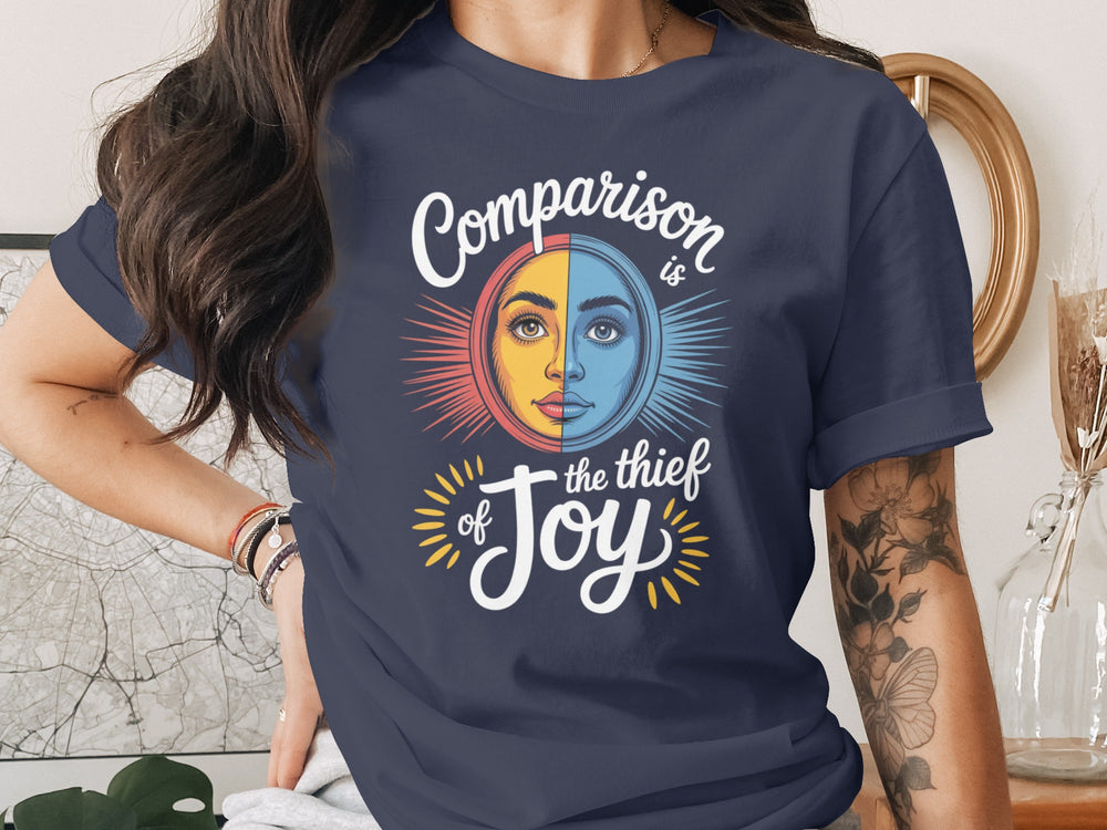 comparison is the thief of joy split sun-and-moon face — women’s t-shirt