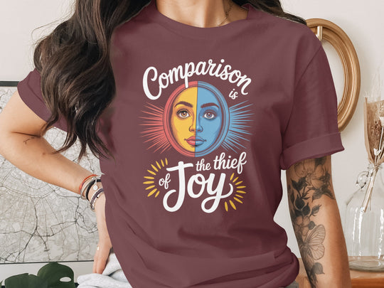 comparison is the thief of joy split sun-and-moon face — women’s t-shirt