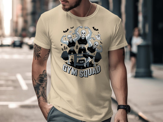 Halloween T-shirt for men with skeletons flexing around a heavy barbell, “Gym Squad” text