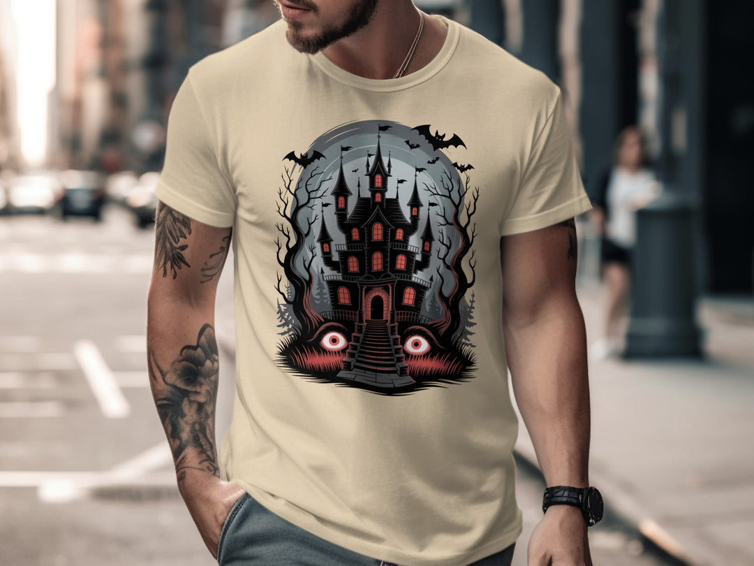 Halloween T-shirt for men with haunted mansion, red windows, bats and eerie eyes graphic
